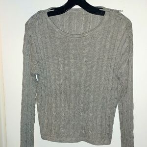 35% Polyester and 65% Cotton size Large. Long sleeve crop sweater top and shorts